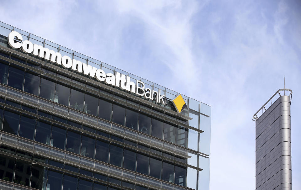 The Commonwealth Bank branding is displayed on its headquarters in Sydney, Wednesday, Feb. 6, 2019. The Commonwealth Bank of Australia recorded a drop in statutory net profit in its latest half-year to 4.6 billion Australian dollars ($3.3 billion) as the nation's biggest lender was hit by costs for misconduct as well as lower profit margins and a downturn in the housing market. (AP Photo/Rick Rycroft)