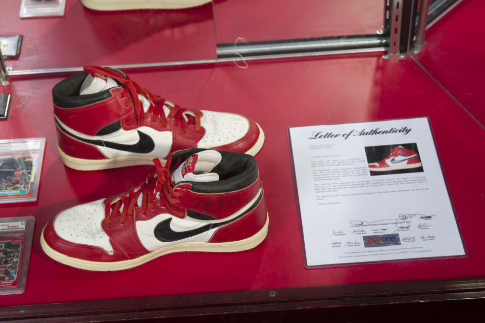 A pair of Nike Air Jordan 1s, worn and signed by NBA basketball legend Michael Jordan in his rookie season, is pictured at the "ShoeZeum" in downtown Las Vegas, Nevada September 25, 2012. Record keepers at the Guinness Book of World Records recently certified that Jordan Michael Geller's Shoezeum, a shrine to Nike that he says includes one of every model of Air Jordans ever made, holds the record for the world's largest collection of sneakers, with more than 2,500 pairs, all but eight of which are Nikes. Nike did not respond to calls for comment. Picture taken September 25, 2012. REUTERS/Steve Marcus (UNITED STATES - Tags: SOCIETY SPORT BASKETBALL)