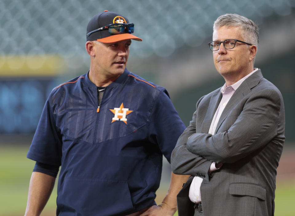 HOUSTON, TX - APRIL 04:  Manager A.J. Hinch #14 of the Houston Astros and general manager Jeff Luhnow talk during batting practice at Minute Maid Park on April 4, 2017 in Houston, Texas.  (Photo by Bob Levey/Getty Images)