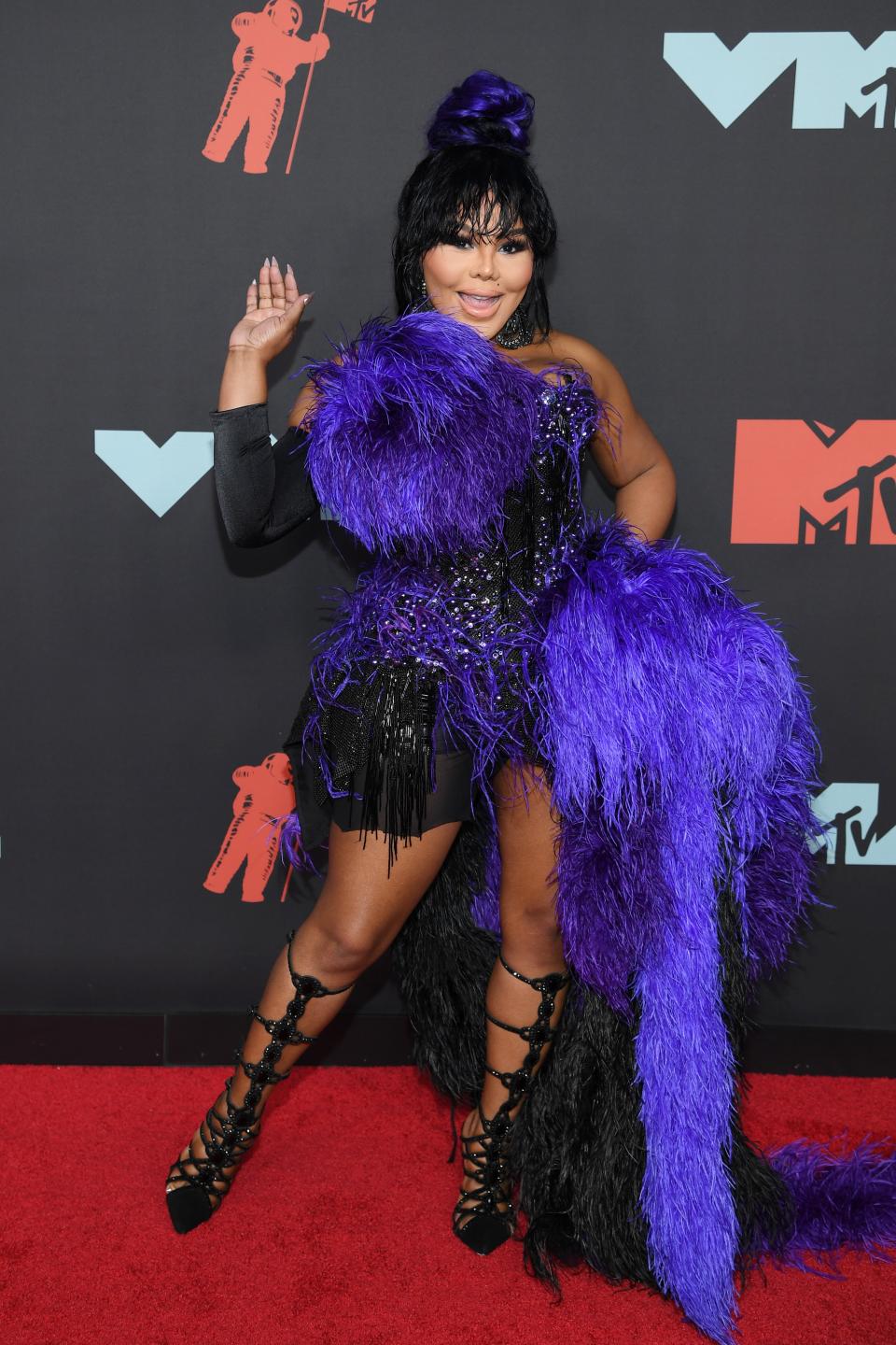 <h1 class="title">Lil' Kim</h1><cite class="credit">Photo: Getty Images</cite>