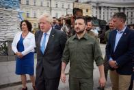 British PM Johnson and Ukraine's President Zelenskiy walk at Mykhailivska Square in Kyiv