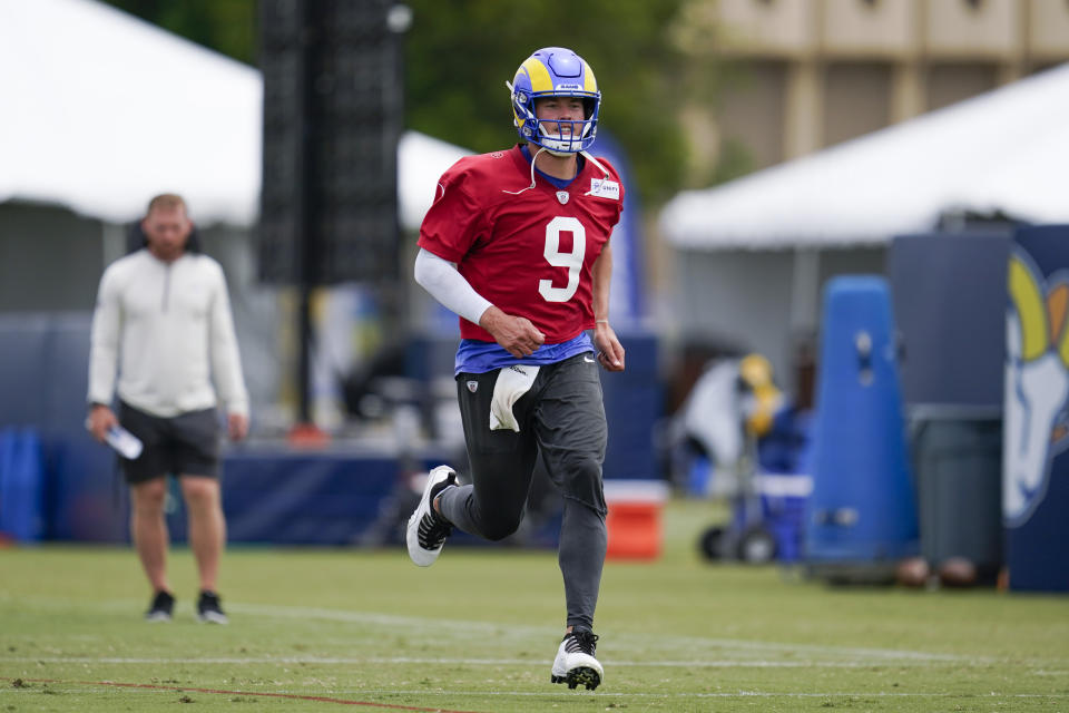 Los Angeles Rams quarterback Matthew Stafford (9) participates in drills at the NFL football team's practice facility in Irvine, Calif. Thursday, Aug. 4, 2022. (AP Photo/Ashley Landis)