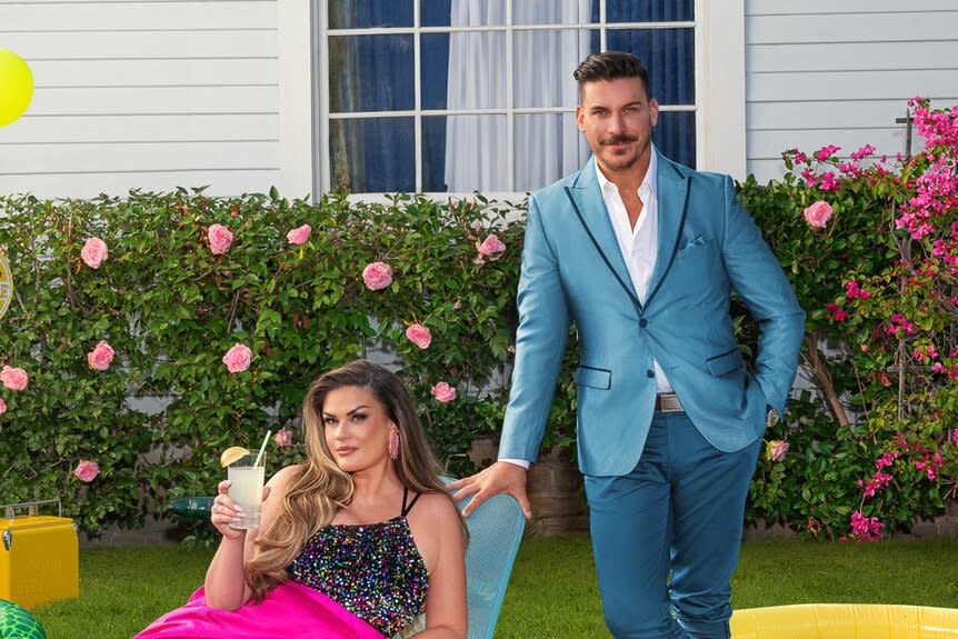 Brittany Cartwright and Jax Taylor on a grass lawn together