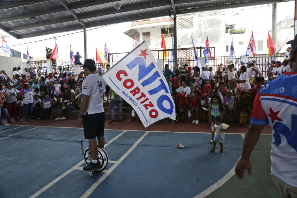 In this April 14, 2019, supporters of presidential frontrunner Laurentino Cortizo of the Democratic Revolutionary Party, attend a campaign rally in Veracruz, Panama. "What Odebrecht has done in Latin America and Panama cannot be forgiven," Cortizo said in a recent interview days after the campaign's final televised debate. He promised to end corruption if elected: "Convicted companies, forget about Panama!" (AP Photo/Arnulfo Franco)