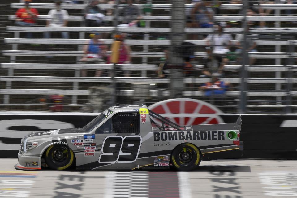 Ben Rhodes drives down the front stretch during a NASCAR Truck Series auto race at Texas Motor Speedway in Fort Worth, Texas, Saturday, June 12, 2021. (AP Photo/Larry Papke)