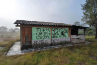 Graffiti on a house reads 'Carlos Telcel Out' (referring to Mexican tycoon Carlos Slim and his mobile telephone company Telcel) in Santa Cruz Itundujia, in Oaxaca state, Mexico, September 28, 2016. Picture taken September 28, 2016. REUTERS/Christine Murray