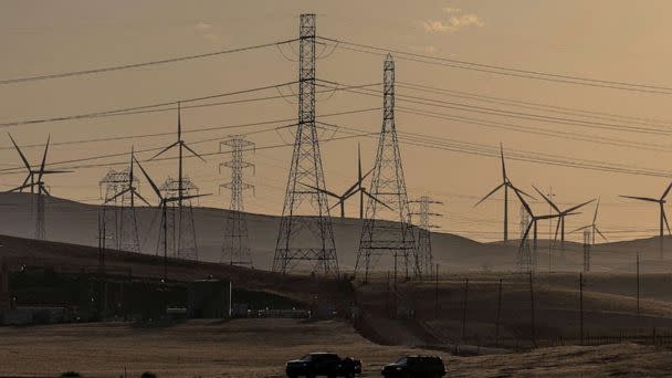 PHOTO: In this Aug. 17, 2022, file photo, windmills and power lines are shown near Tracy, Calif.  (Carlos Barria/Reuters)