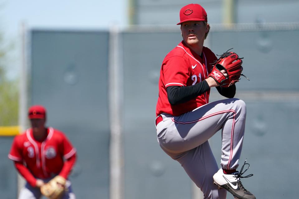 Cincinnati Reds minor league pitcher Andrew Abbott (21) delivers during a spring training game against the Cleveland Guardians, Wednesday, March 23, 2022, at the team's spring training facility in Goodyear, Ariz.