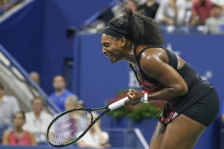 Serena Williams of the U.S. celebrates winning a point in her quarterfinals match against her sister and compatriot Venus Williams at the U.S. Open Championships tennis tournament in New York, September 8, 2015. REUTERS/Shannon Stapleton