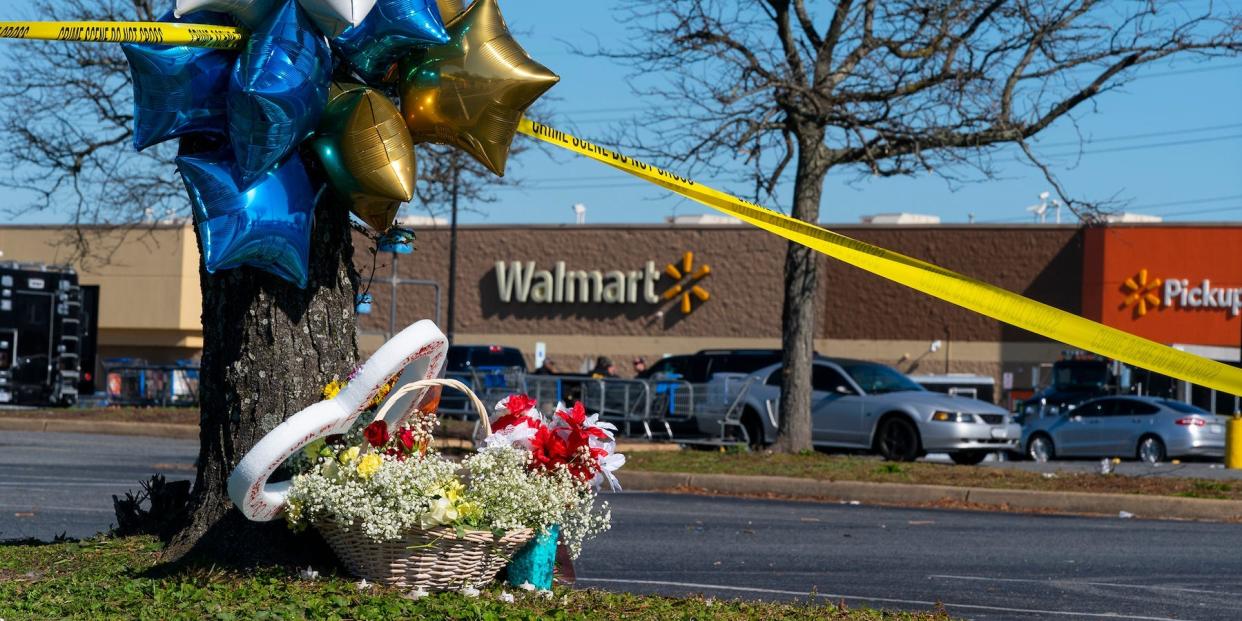 Flowers and balloons have been placed near the scene of a mass shooting at a Walmart in Chesapeake, Virginia, on Wednesday.