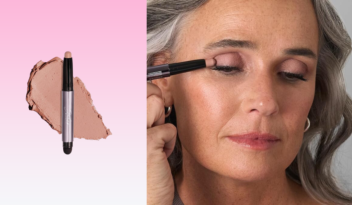 older woman applying eyeshadow stick