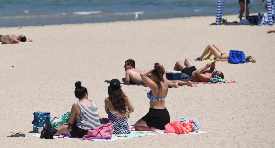 Melbourne heatwave: Beachgoers cool off at Port Melbourne beach on Thursday. 