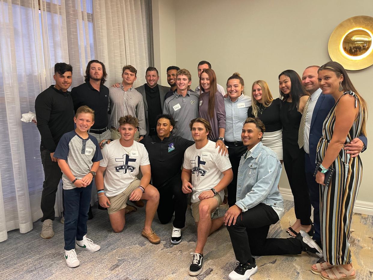 Former Florida quarterback Tim Tebow takes a picture with FSW athletes in the Blue Room during the 15th Annual FCA Celebration Dinner, held at the Naples Grande Beach Resort on Jan. 17, 2022. Tickets started at $300.