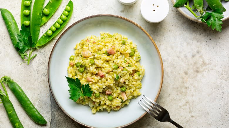 Risotto with peas on plate