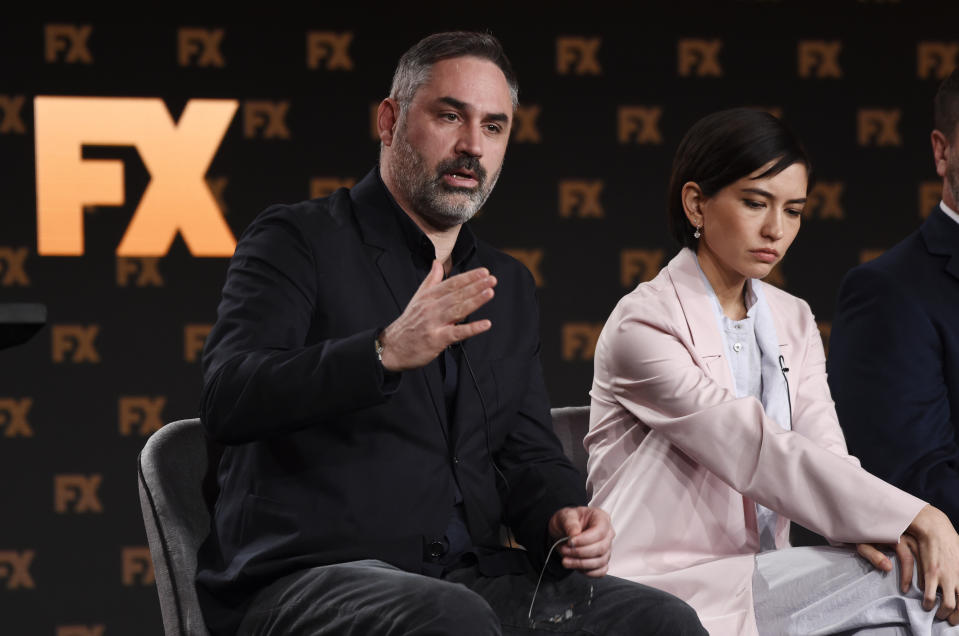 Alex Garland, left, the creator/executive producer/writer/director of the FX on Hulu limited series "Devs," answers a question as cast member Sonoya Mizuno looks on at the 2020 FX Networks Television Critics Association Winter Press Tour, Thursday, Jan. 9, 2020, in Pasadena, Calif. (AP Photo/Chris Pizzello)