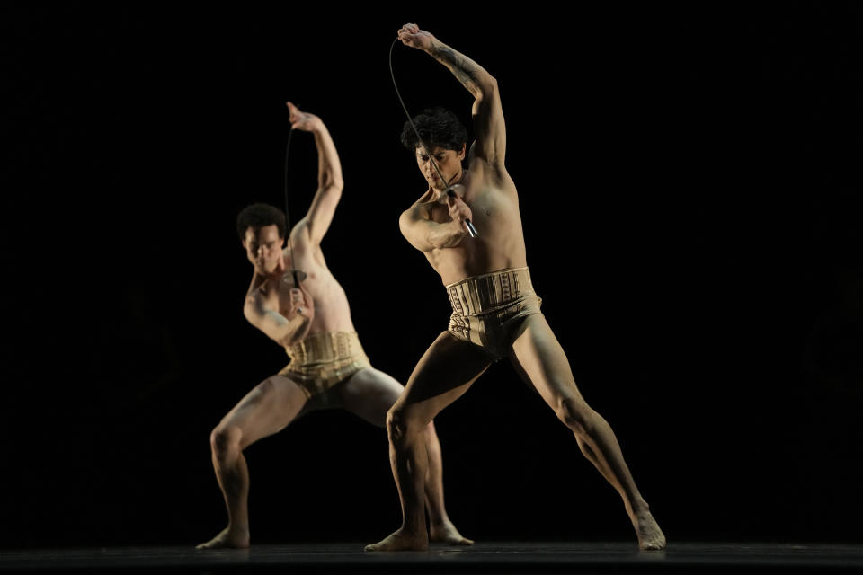 American Ballet Theater's principle dancer Herman Cornego, right, rehearses for a performance at the Shanghai Grand Theater in Shanghai, Thursday, Nov. 2, 2023. The American national ballet company is returning to China for the first time in a decade for shows in Shanghai and Beijing in the latest sign strained relations between the United States and China are beginning to thaw. (AP Photo/Ng Han Guan)