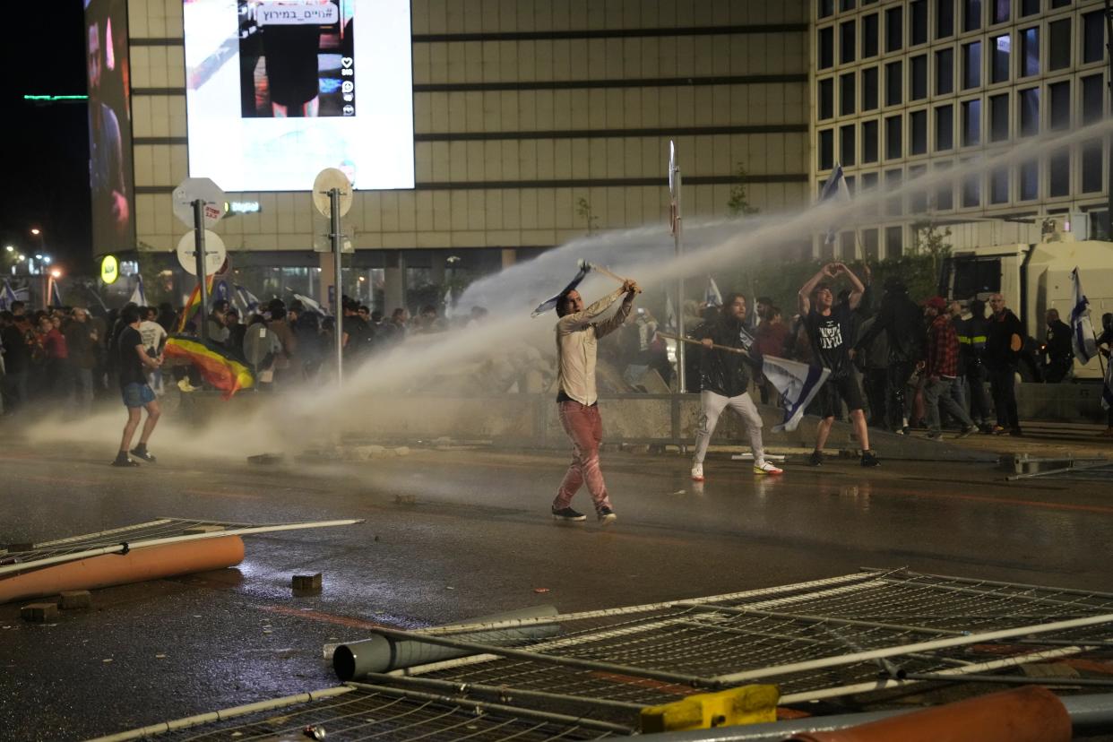 Police use water canon to disperse anti government protesters in Tel Aviv, Israel, Monday, March 27, 2023. (AP)