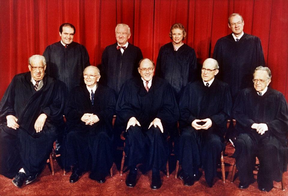 In this April 15, 1988, file photo, members of the U.S. Supreme Court pose for a portrait in Washington. From left, front row are: Associate Justices Thurgood Marshall; William Brennan Jr.; Chief Justice William Rehnquist; Byron White; and Harry Blackmun. Back row from left are: Antonin Scalia; John Paul Stevens; Sandra Day O'Connor and Anthony M. Kennedy.