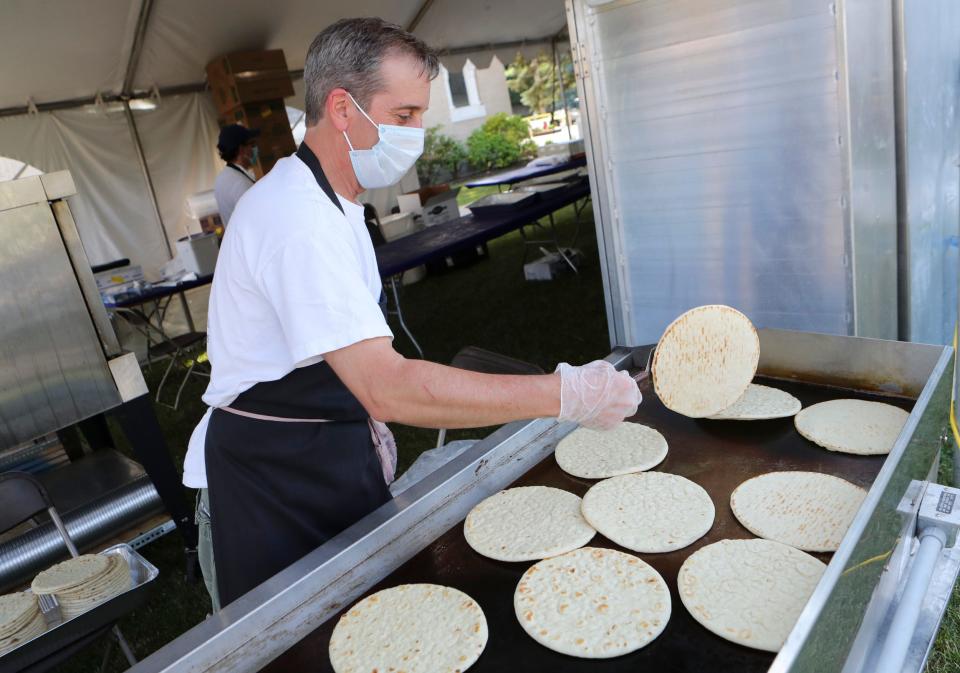 Greek Festival will celebrate turning 46 at Holy Trinity Greek Orthodox Church in Wilmington, from June 6 to 11. Mike Logothetis flips flatbread for gyros on the first day of the Greek Festival's scaled-down operation held in June, 2020.