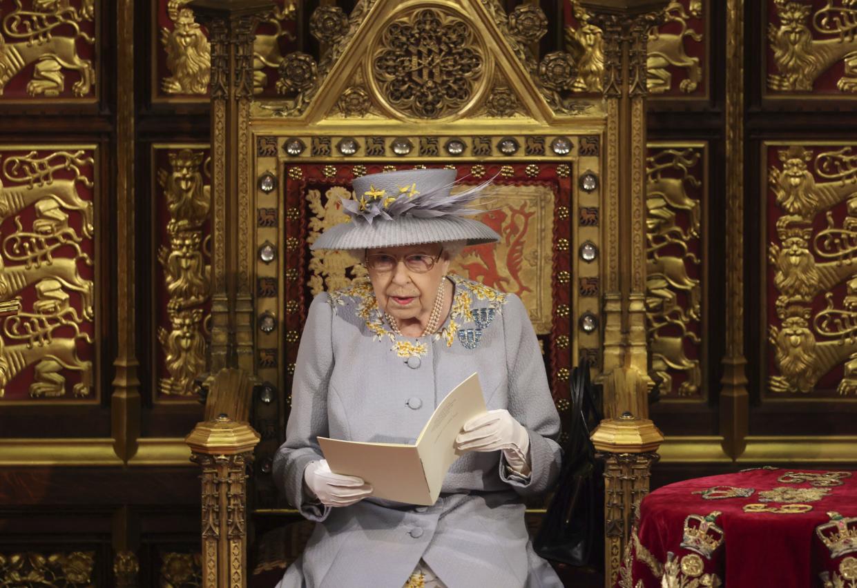 Britain's Queen Elizabeth II delivers a speech in the House of Lords during the State Opening of Parliament at the Palace of Westminster in London on May 11, 2021.
