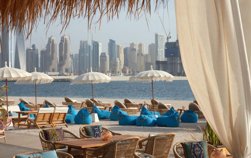 Lounges and parasols set up along Palm West Beach