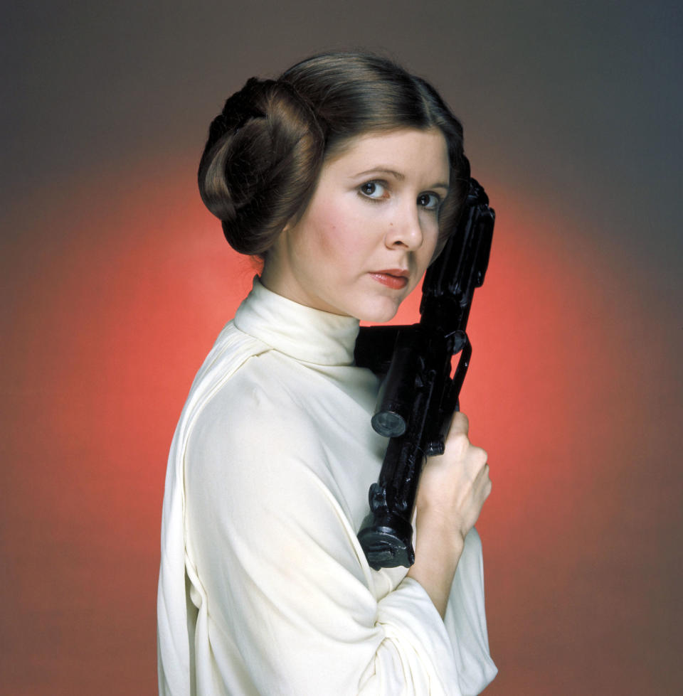 No merchandising.  Editorial use only.  No use of book cover.  Mandatory Credit: Photo by Lucasfilm/20th Century Fox/REX/Shutterstock (5886297ew) Carrie Fisher Star Wars Episode IV - A New Hope - 1977 Director: George Lucas Lucasfilm/20th Century Fox USA Film Portrait Scifi Star Wars (1977) The War of the stars