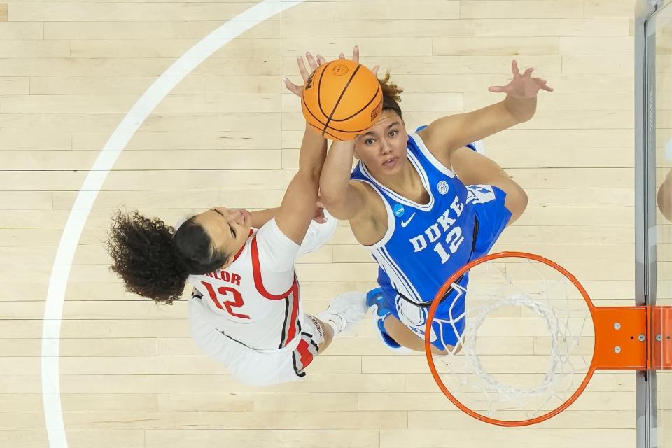 Mar 24, 2024; Columbus, OH, USA; Duke Blue Devils forward Delaney Thomas (12) shoots over Ohio State Buckeyes guard Celeste Taylor (12) during the first half of the women’s NCAA Tournament second round at Value City Arena.