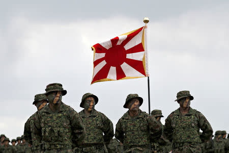 Soldiers of Japanese Ground Self-Defense Force (JGSDF)'s Amphibious Rapid Deployment Brigade, Japan's first marine unit since World War Two, gather at a ceremony activating the brigade at JGSDF's Camp Ainoura in Sasebo, on the southwest island of Kyushu, Japan April 7, 2018. REUTERS/Issei Kato