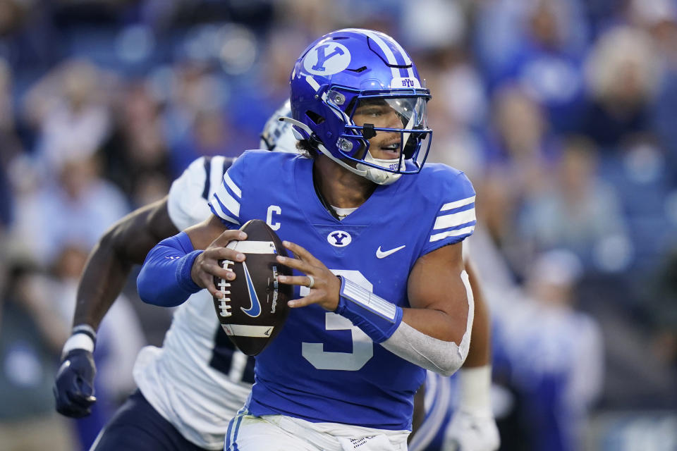 BYU quarterback Jaren Hall looks for a receiver during the first half of the team's NCAA college football game against Utah State on Thursday, Sept. 29, 2022, in Provo, Utah. (AP Photo/Rick Bowmer)