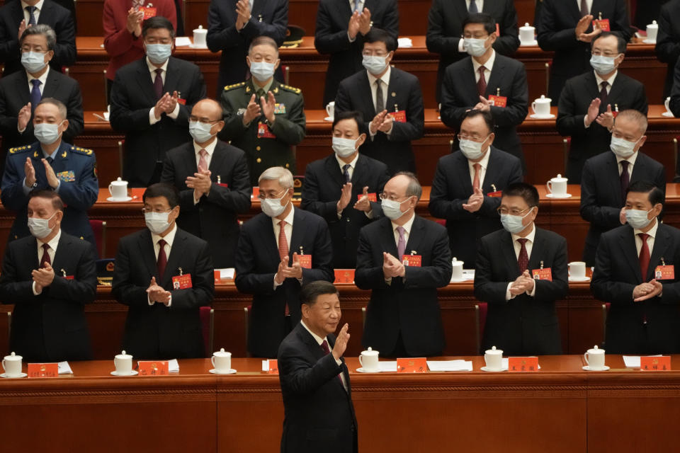 Chinese President Xi Jinping arrives for the opening ceremony of the 20th National Congress of China's ruling Communist Party held at the Great Hall of the People in Beijing, China, Sunday, Oct. 16, 2022. China on Sunday opens a twice-a-decade party conference at which leader Xi Jinping is expected to receive a third five-year term that breaks with recent precedent and establishes himself as arguably the most powerful Chinese politician since Mao Zedong. (AP Photo/Mark Schiefelbein)