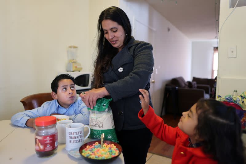 Emiliana, 32, prepares breakfast for her son, Leonardo, 10, and daughter, Emily, 5, at their apartment in Los Angeles