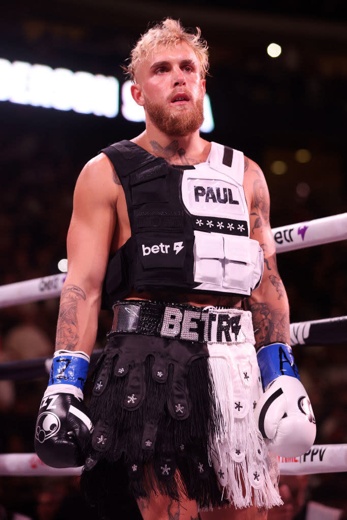 closeup of him with boxing gloves in a ring