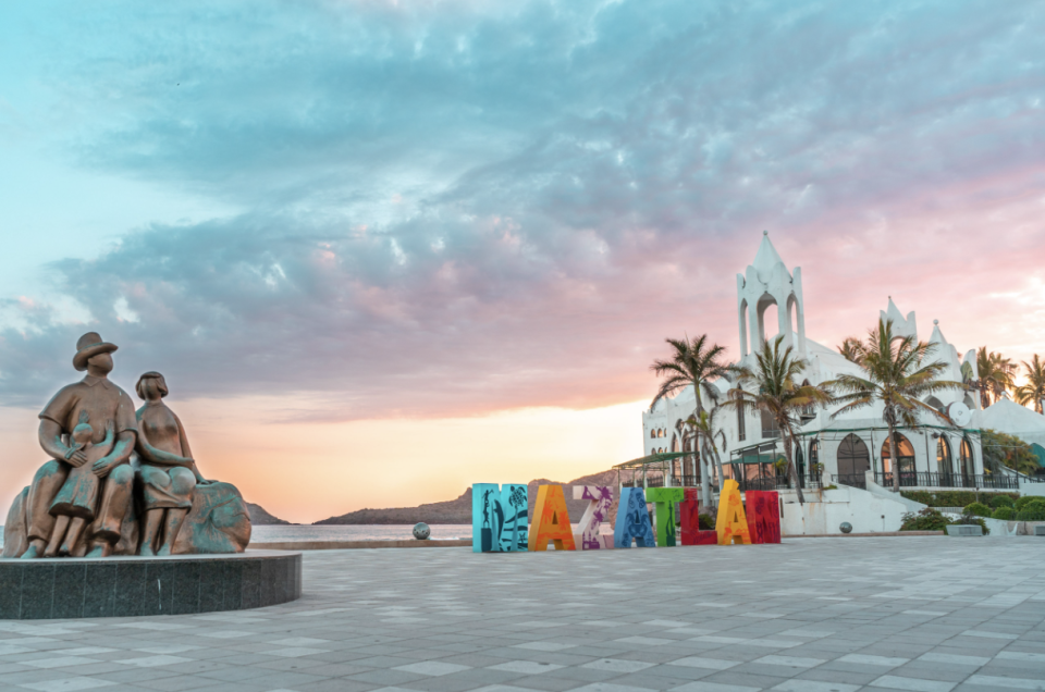 a group of statues in a plaza