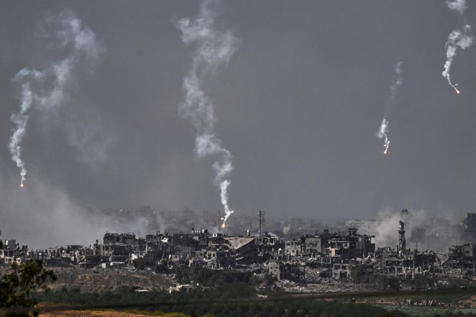 A picture taken from Israel's southern city of Sderot shows flares dropped by Israeli forces above the north of the Gaza Strip (AFP via Getty Images)