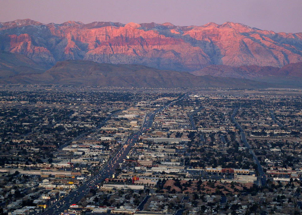 FILE - In this Feb. 9, 2005, file photo, shows the suburbs of Las Vegas from atop the Stratosphere tower looking west down Sahara Ave., towards the Spring Mountains. Despite drought, cities in the U.S. West expect their populations to grow considerably in the coming decades. From Phoenix to Boise, officials are working to ensure they have the resources, infrastructure and housing supply to meet growth projections. In certain parts of the region, their efforts are constrained by the fact that sprawling metro areas are surrounded by land owned by the federal government. U.S. Sen. Catherine Cortez Masto wants to remedy the issue in Las Vegas by strengthening protections for some public lands while approving the sale of others to commercial and residential developers. (AP Photo/Joe Cavaretta, File)