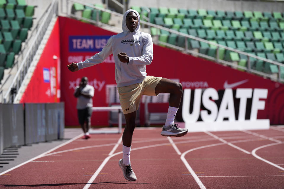 Eric Gregory stretches on the track at the U.S. Olympic Track and Field Trials, Wednesday, June 19, 2024, in Eugene, Oregon. The deaf sprinter from Gallaudet University in Washington, D.C., earned the last spot into the 400-meter field at the U.S. Olympic Trials this week. (AP Photo/Charlie Neibergall)