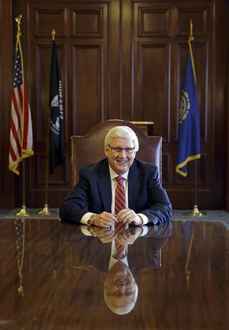 New Hampshire Senate President Chuck Morse sits at a table in the executive council chambers at the Statehouse, Wednesday, Jan. 4, 2017, in Concord, N.H. For two days only, Senate President Morse is New Hampshire's governor. The Republican landed in the state's top job due to a unique political time, with Maggie Hassan resigning to become a U.S. Senator two days before Republican Gov.-elect Chris Sununu is officially sworn in. (AP Photo/Elise Amendola)