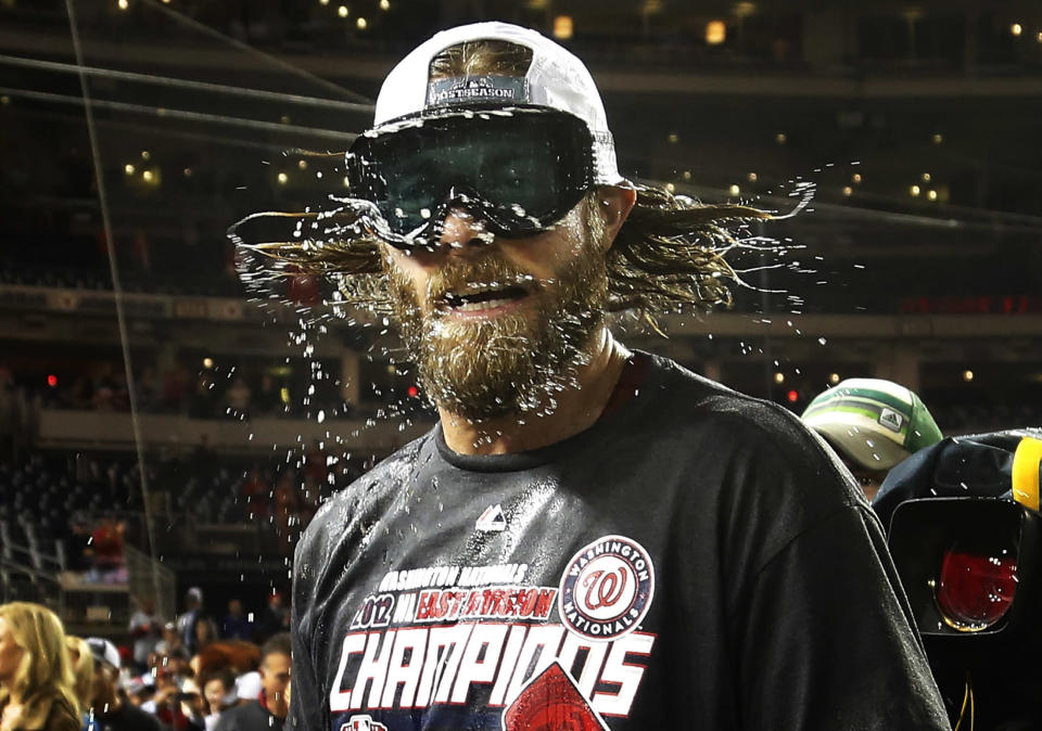 Nationals Werth shakes beer and champagne out of his hair while celebrating with teammates after they clinched the National League East in Washington