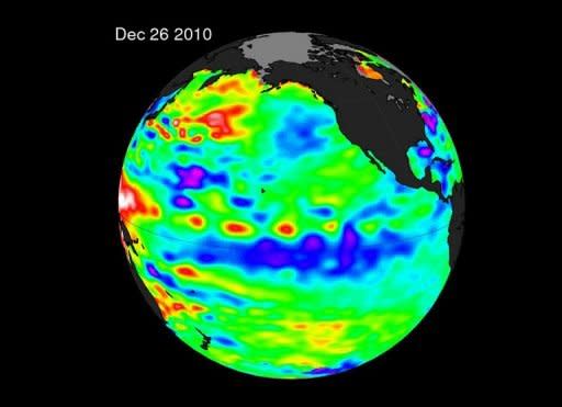 In this enhanced NASA satellite illustration from December 26, 2010, the La Niña is evident by the large pool of cooler than normal (blue and purple) water stretching from the eastern to the central Pacific Ocean. Despite the natural cooling trend brought by back-to-back La Nina effects, 2011 was among the 12 highest years on record for global sea surface temperatures