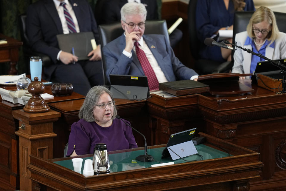 Witness Katherine "Missy" Minter Cary, former chief of staff in the Texas Attorney General's office, front, testifies during day five of the impeachment trial for Texas Attorney General Ken Paxton in the Senate Chamber at the Texas Capitol, Monday, Sept. 11, 2023, in Austin, Texas. (AP Photo/Eric Gay)