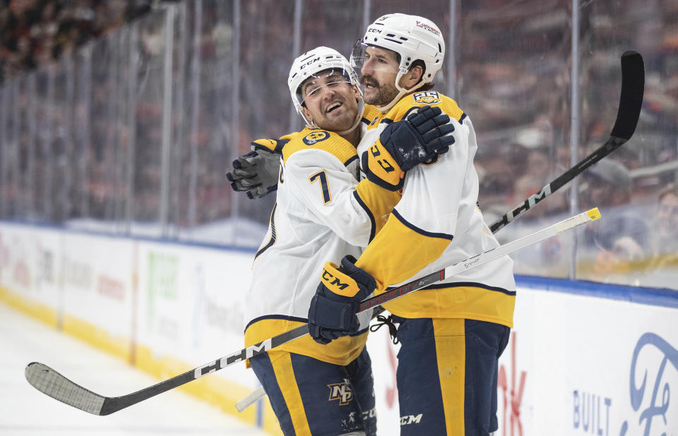 Nashville Predators' Marc Del Gaizo (7) and Filip Forsberg (9) celebrate Forsberg's goal against the Edmonton Oilers during the first period of an NHL game in Edmonton, Alberta, Saturday, Nov. 4, 2023. (Jason Franson/The Canadian Press via AP)