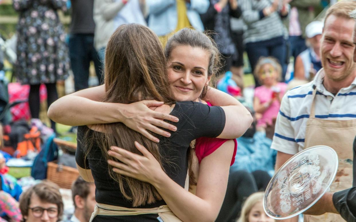 Hugs all round: Sophie Faldo has won this year's Bake Off - PA