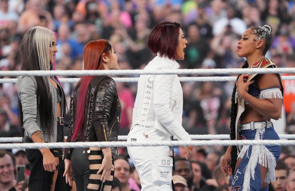 Bayley makes her return from injury alongside Dakota Kai (left) and Iyo Sky as they face off with Bianca Belair during SummerSlam 2022 at Nissan Stadium.