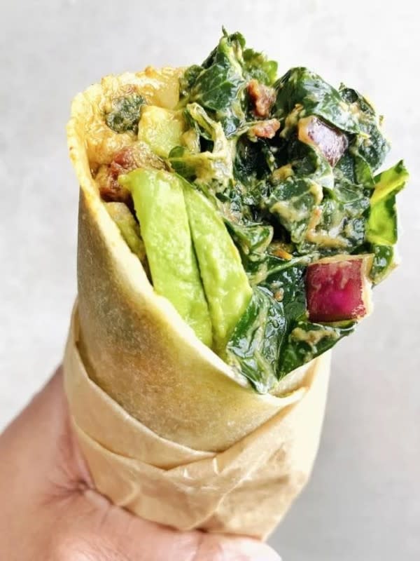 <p>The Vgn Way</p><p>Less than 10 ingredients, easy, fast & simple to put together. Delicious, satisfying and nutritionally dense this raw spicy kale salad wrap recipe makes for a great easy lunch or dinner.</p><p><strong>Get the recipe: <a href="https://www.thevgnway.com/gluten-free-vegan-spicy-kale-salad-recipe/" rel="nofollow noopener" target="_blank" data-ylk="slk:Spicy Kale Salad Wrap;elm:context_link;itc:0;sec:content-canvas" class="link ">Spicy Kale Salad Wrap</a></strong></p>