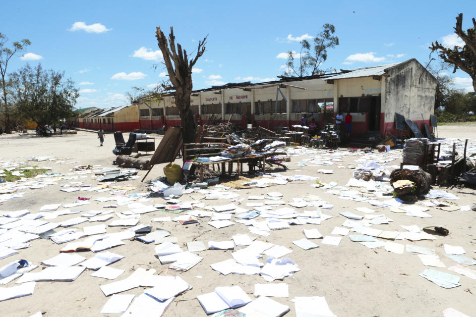 School books at Inchope primary school in Inchope, Mozambique, are left to dry in the sun after the school was damaged by Cyclone Idai, Monday March, 25, 2019. Cyclone Idai's death toll has risen above 750 in the three southern African countries hit 10 days ago by the storm, as workers rush to restore electricity, water and try to prevent outbreak of cholera. (AP Photo/Tsvangirayi Mukwazhi)