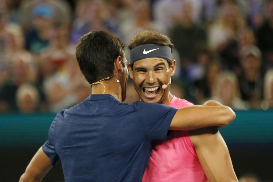 MELBOURNE, AUSTRALIA - JANUARY 15: Novak Djokovic of Serbia and Rafael Nadal of Spain hug during the Rally for Relief Bushfire Appeal event at Rod Laver Arena on January 15, 2020 in Melbourne, Australia. (Photo by Darrian Traynor/Getty Images)