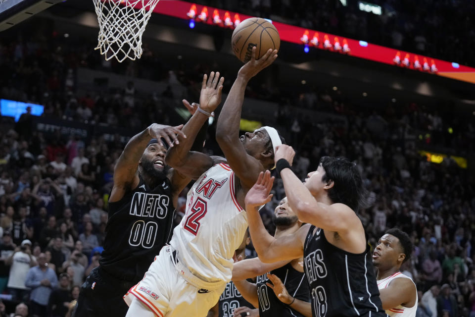 Miami Heat forward Jimmy Butler (22) attempts a shot during final seconds of the second half of an NBA basketball game against the Brooklyn Nets, Sunday, Jan. 8, 2023, in Miami. (AP Photo/Wilfredo Lee)