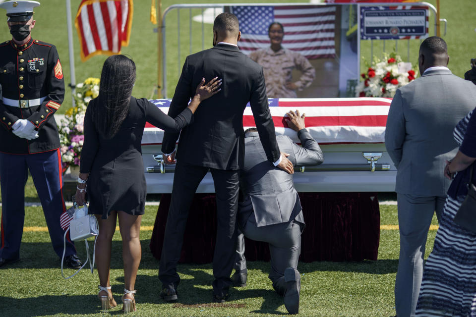 Mourners pay their respects to Sgt. Johanny Rosario Pichardo, a U.S. Marine who was among 13 service members killed in a suicide bombing in Afghanistan, during a public wake in her hometown of Lawrence, Mass., Tuesday, Sept. 14, 2021. (AP Photo/David Goldman)