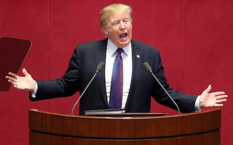 US President Donald Trump addresses the National Assembly in Seoul - Credit: AFP