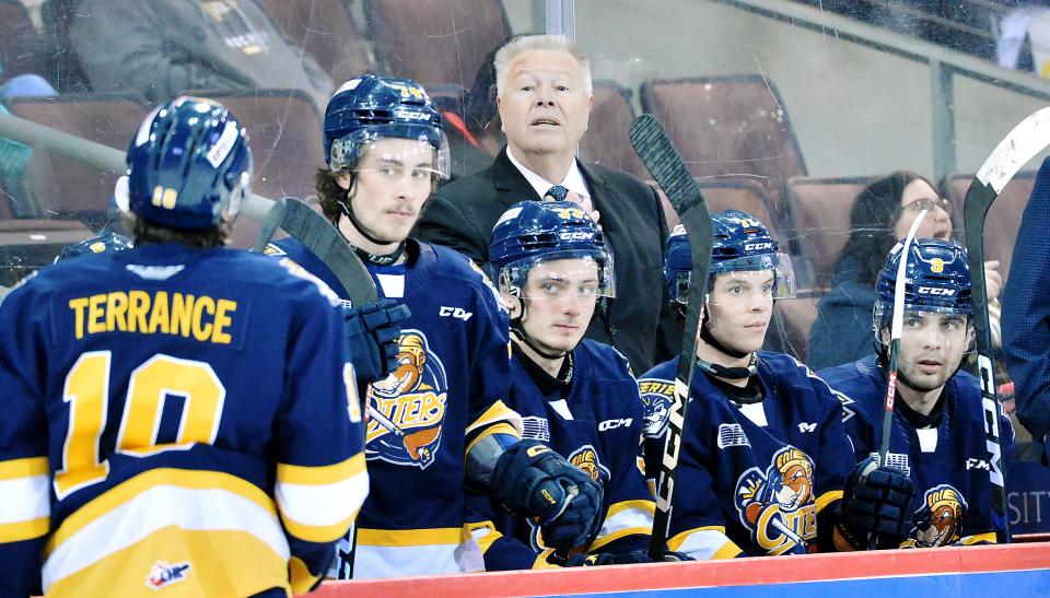 Erie Otters head coach Stan Butler, center, works during a game Feb. 28 against the Hamilton Bulldogs inside Erie Insurance Arena.